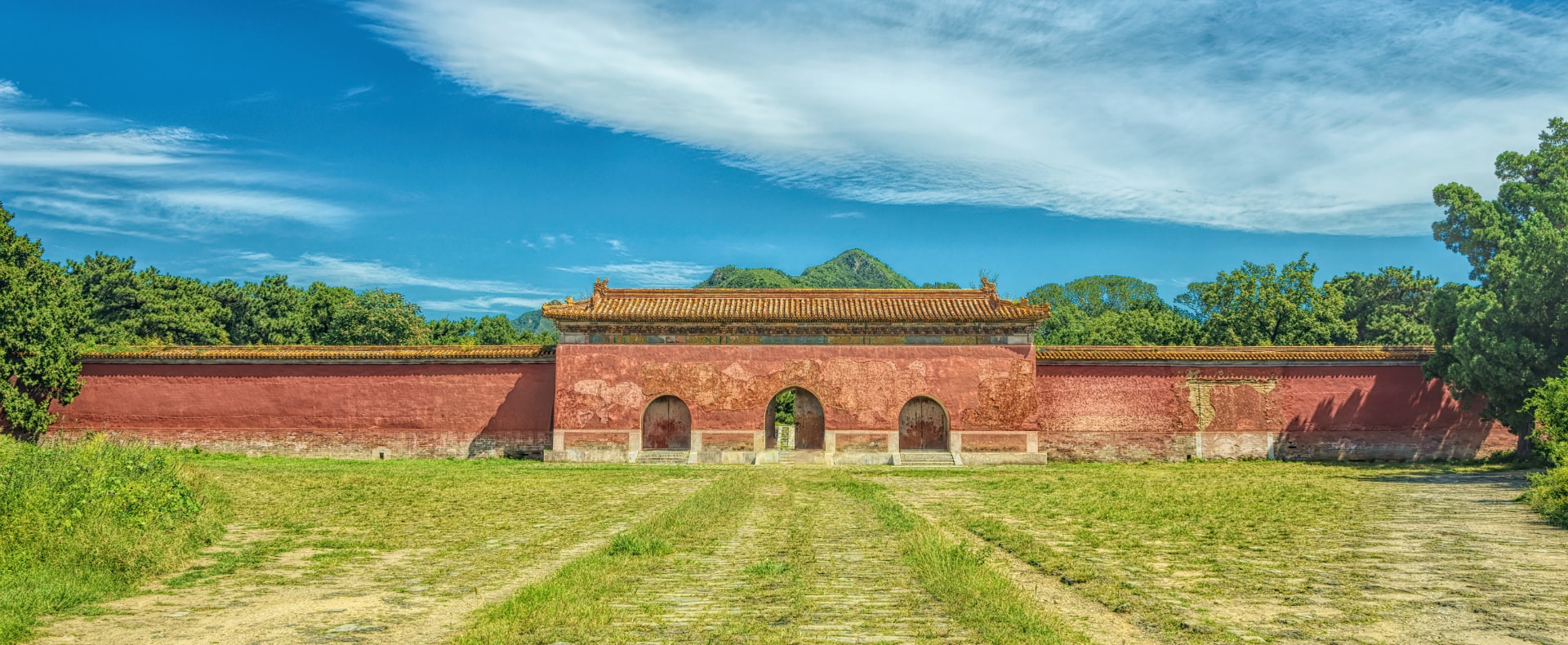  The image shows the gateway to the Ming Dynasty Tombs, a UNESCO World Heritage Site located in China.